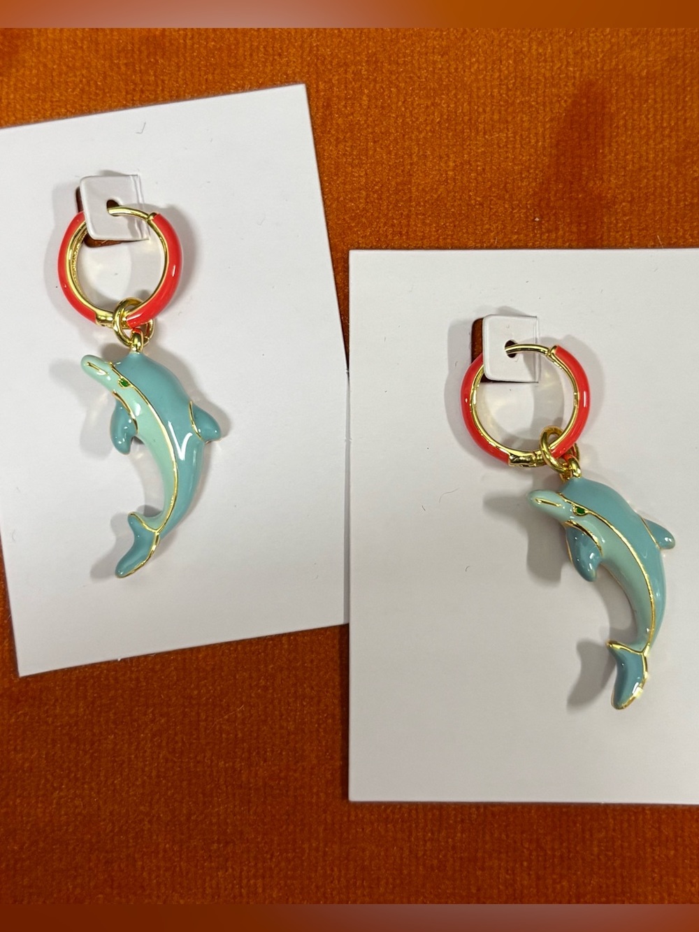 ManRepeller dolphin hoop earring pink/ blue enamel.Never worn..by Leandra Medine